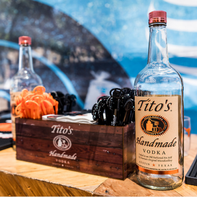 Tito's Vodka and branded wood crate on bar top